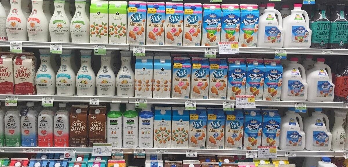 a vegan milk section in a store