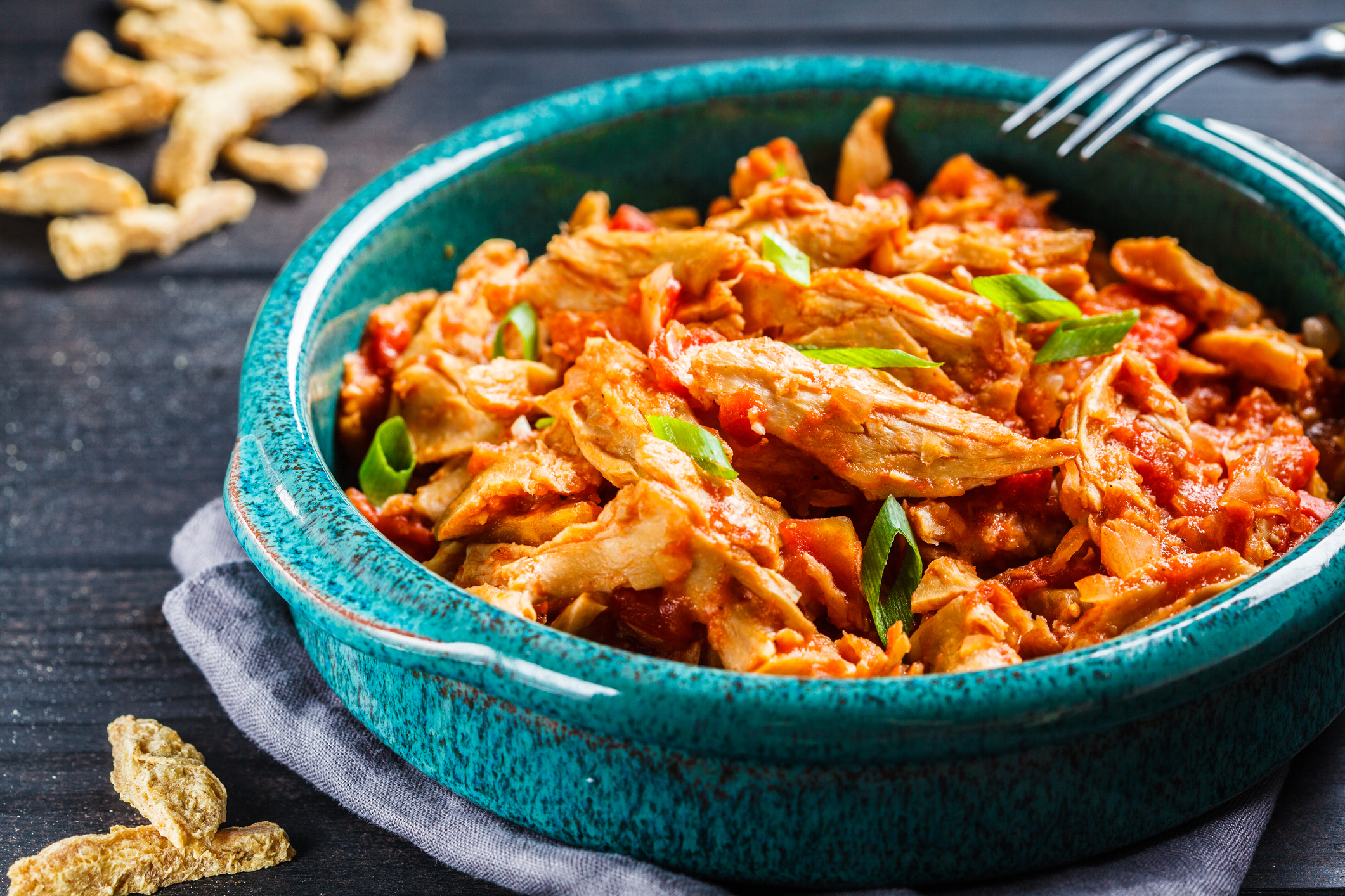 Soy vegan meat in tomato sauce in a blue dish
