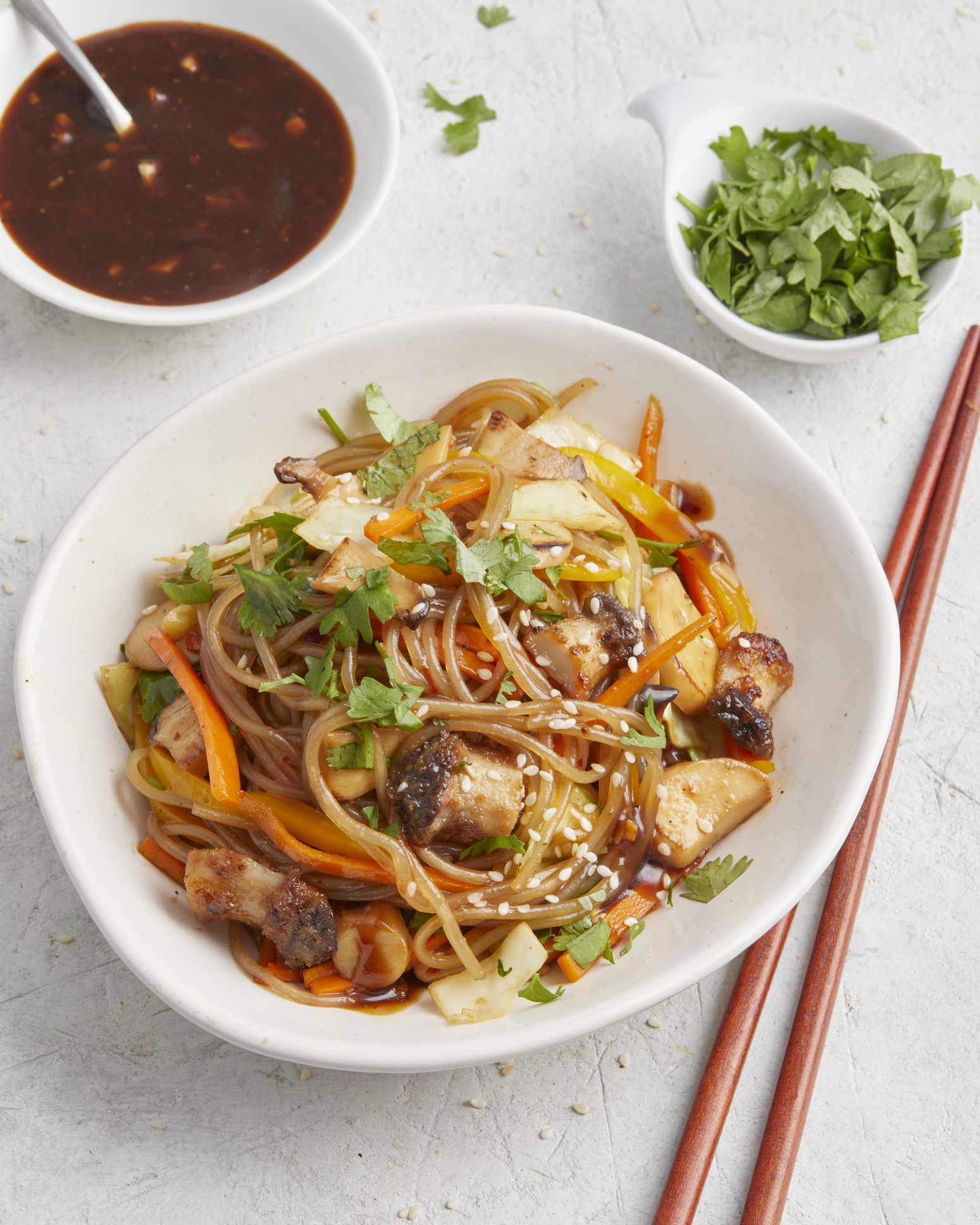 Colorful vegan stir-fry with vegetables, sauce and glass noodles