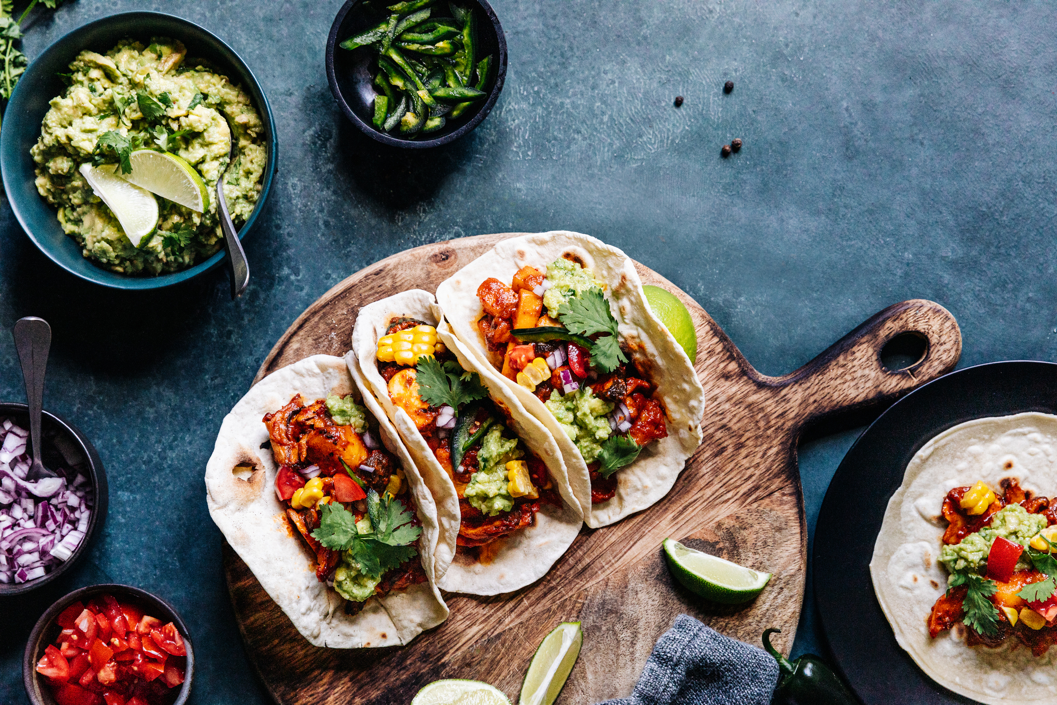 Vegan tacos on a wooden board in kitchen