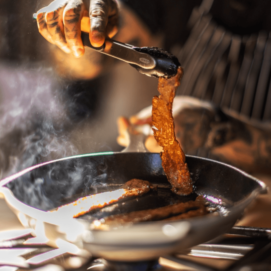 a chef frying vegan bacon by myforestfoods
